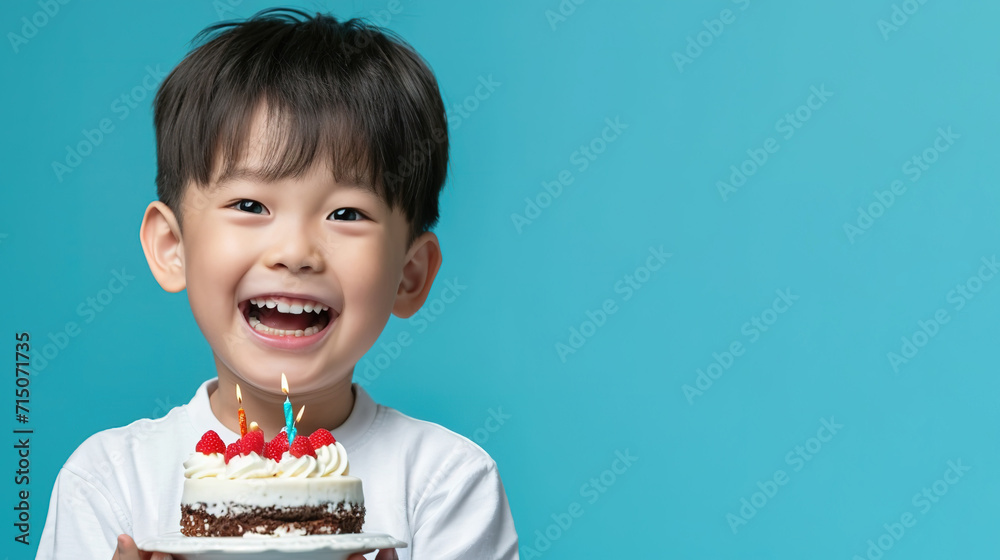Asian boy holds cake. Prepares for party or birthday celebration expresses good emotions. Birthday party for kids. Asian boy holds cake. Prepares for party or birthday celebration expresses good emotions. Birthday party for kids.