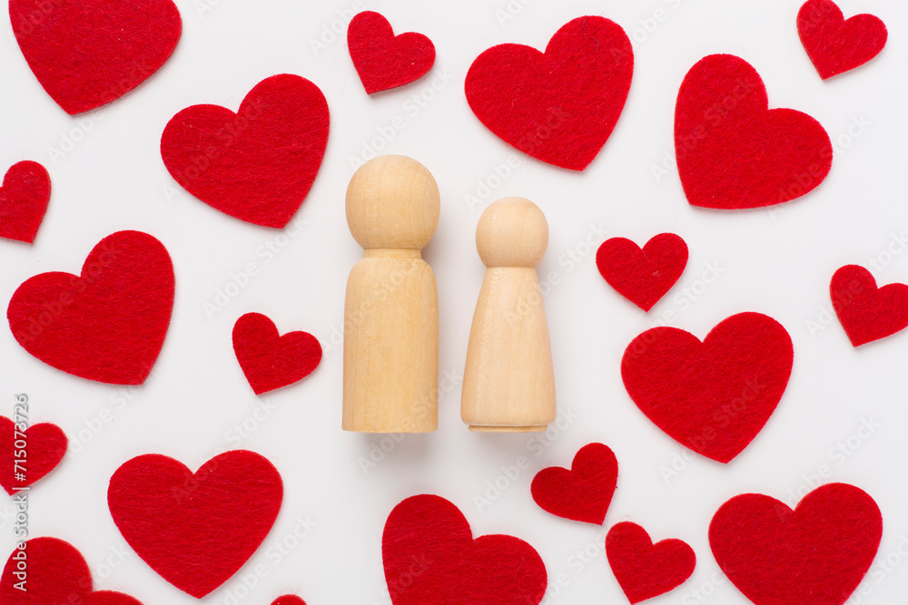 Wooden couple in love on white background, top view. Creative valentine's day composition