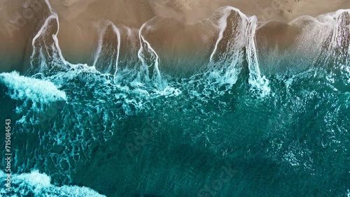 Aerial drone top down view of sea waves break on sand. Beautiful of sea water wave come to beach photo