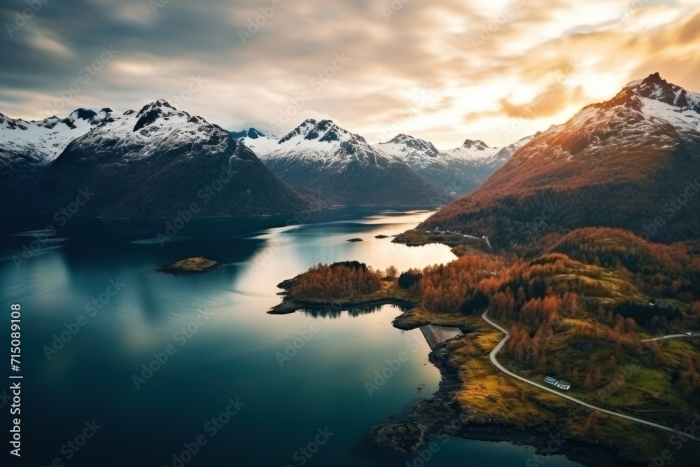 an aerial view of a mountain range and a lake in the foreground with a mountain range in the background. an aerial view of a mountain range and a lake in the foreground with a mountain range in the background.