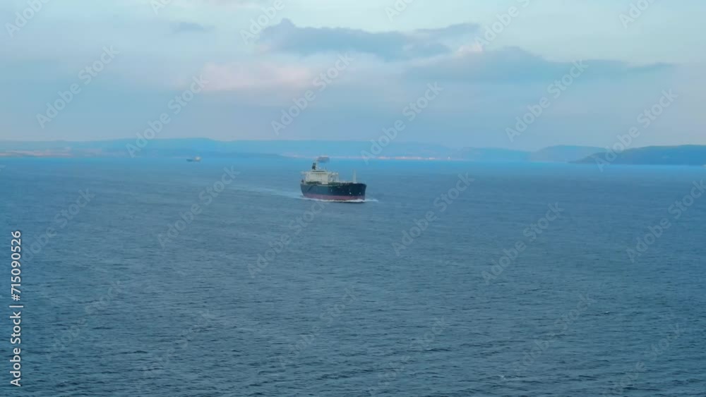 Oil tanker ship underway ship underway through Dardanelles Strait, aerial establishing shot, Worldwide logistic of oil Oil tanker ship underway ship underway through Dardanelles Strait, aerial establishing shot, Worldwide logistic of oil