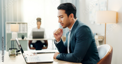 Man at desk, laptop and thinking in coworking space, market research or online schedule at consulting agency. Office, idea and businessman at computer writing email article review, feedback or report photo
