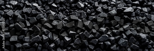 Coal Piled High, the Black Energy-Rich Mineral Used as a Fossil Fuel in Industry photo
