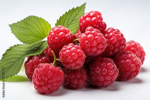  a bunch of raspberries with a leaf on a white surface with a green leaf on top of it.