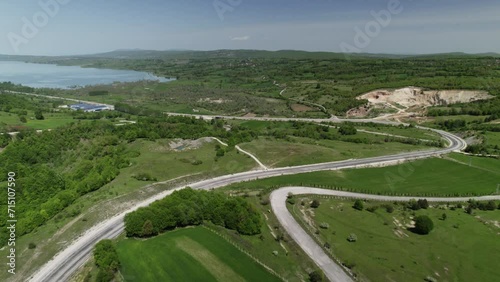 lake in a green valley, highway passing by and quarry in the mountain, Ladik Lake, Samsun Turkey photo