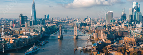 Aerial view of the Iconic Tower Bridge connecting Londong with Southwark on the Thames River in London, UK. photo