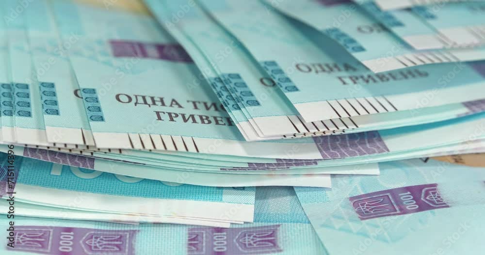 Money of Ukraine. New banknotes 1000 Hryvnia in uncirculated condition, UNC. Real Ukrainian paper money of blue yellow color, UAH. Ukrainian banknotes of max denomination. Cinema 4K 60fps video Money of Ukraine. New banknotes 1000 Hryvnia in uncirculated condition, UNC. Real Ukrainian paper money of blue yellow color, UAH. Ukrainian banknotes of max denomination. Cinema 4K 60fps video