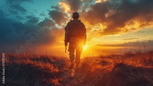 Silhouettes of army soldiers in the fog against a sunset, marines team in action photo