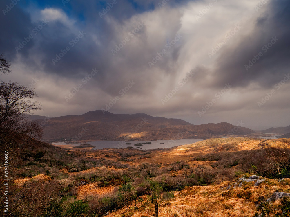 Stunning nature scene with mountains and dark dramatic sky. Ladies view, Killarney, Ireland, ring of Kerry route. Magnificent Irish nature and popular travel and tourist area.