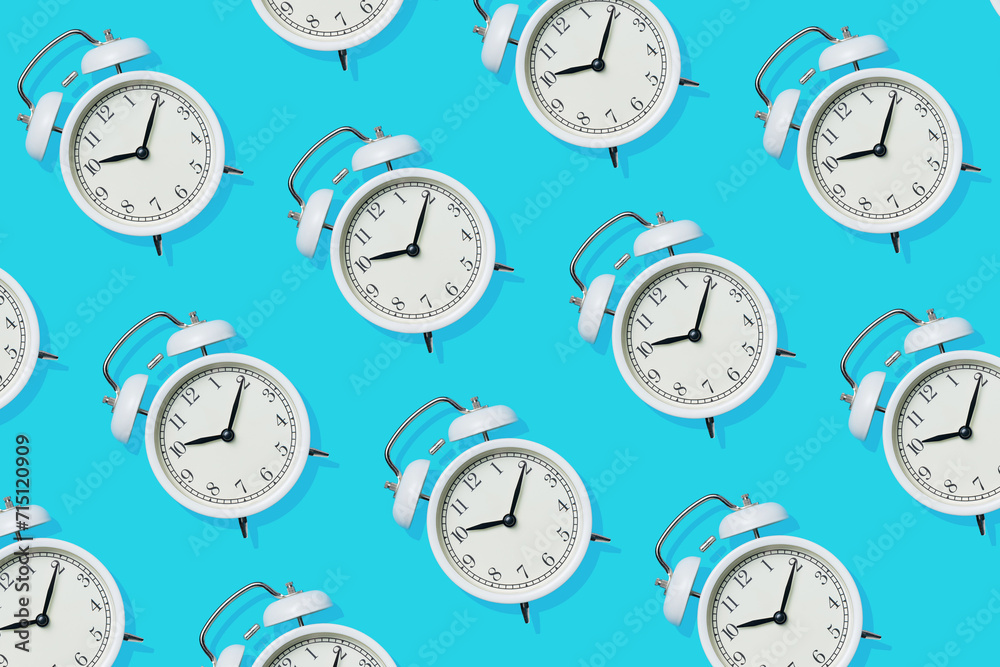 Minimal Alarm Clock Pattern on Blue Background, Top View Minimal Alarm Clock Pattern on Blue Background, Top View