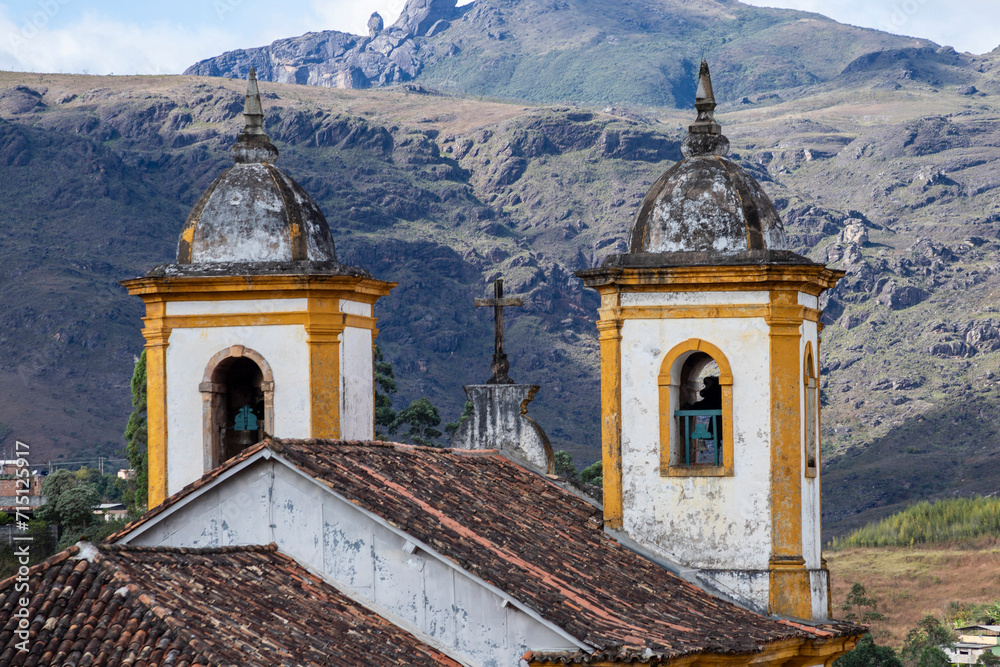 View of towers of historic baroque church Igreja Nossa Senhora das Merces e Perdoes, and mountains, Ouro Preto, Minas Gerais, Brazil