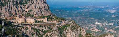 Aerial view of the Benedict church Abbey of Monserrat from Barcelona, Spain. Montserrat Monastery, Santa Maria de Montserrat is a Benedictine abbey located on the mountain of Montserrat