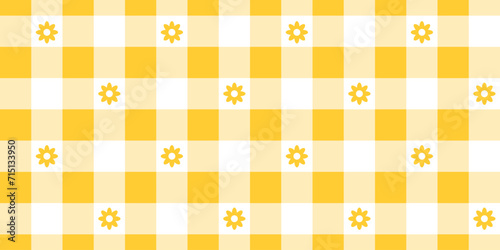 Gingham pattern with flowers. Checkered background with yellow and white squares. Spring or summer tablecloth, napkin, towel or handkerchief design. Wrapping or scrap paper print. Picnic plaid texture photo