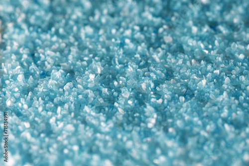 Texture of fine light blue sand crystals close up. Photo for background, with small depth of field