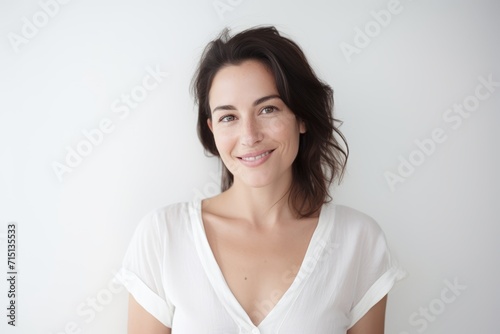 Portrait of a beautiful young woman smiling and looking at the camera