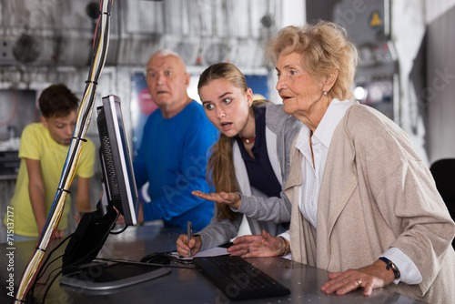 Positively minded family together solve puzzles in a quest room in the form of an abandoned laboratory photo