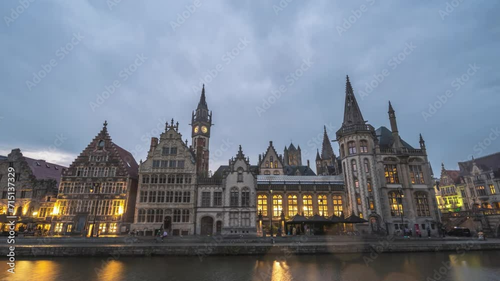 Ghent Belgium, city skyline day to night time lapse at St Michael's Bridge (Sint-Michielsbrug) with Leie River and Korenlei Ghent Belgium, city skyline day to night time lapse at St Michael's Bridge (Sint-Michielsbrug) with Leie River and Korenlei