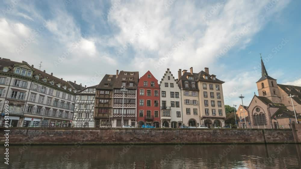 Strasbourg France time lapse 4K, city skyline timelapse at Ill River with colorful half timber house and Saint Nicolas Church Strasbourg France time lapse 4K, city skyline timelapse at Ill River with colorful half timber house and Saint Nicolas Church
