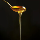 Golden Elixir: The Art of Organic Honey Dripping on a Fresh Honeycomb