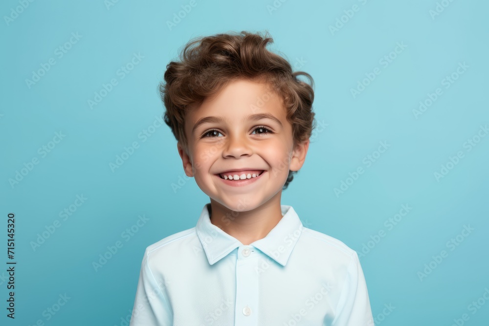 Portrait of a smiling little boy in a shirt on a blue background Portrait of a smiling little boy in a shirt on a blue background
