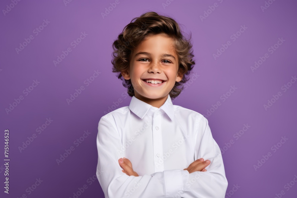 Portrait of a smiling little boy in a white shirt on a purple background Portrait of a smiling little boy in a white shirt on a purple background