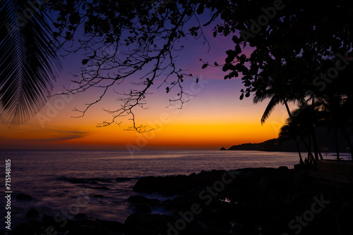 Beautiful colorful sunset or sunrise sky over sea with dramatic clouds nature environment background