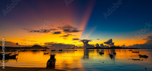 Beautiful colorful sunset or sunrise sky over sea with dramatic clouds nature environment background © panya99