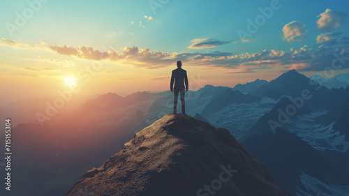 businessman standing on top of the mountain