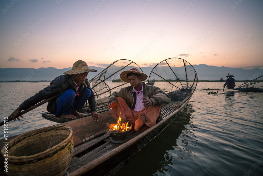 Local fishermen on a boat, Inle lake, Myanmar Local fishermen on a boat, Inle lake, Myanmar