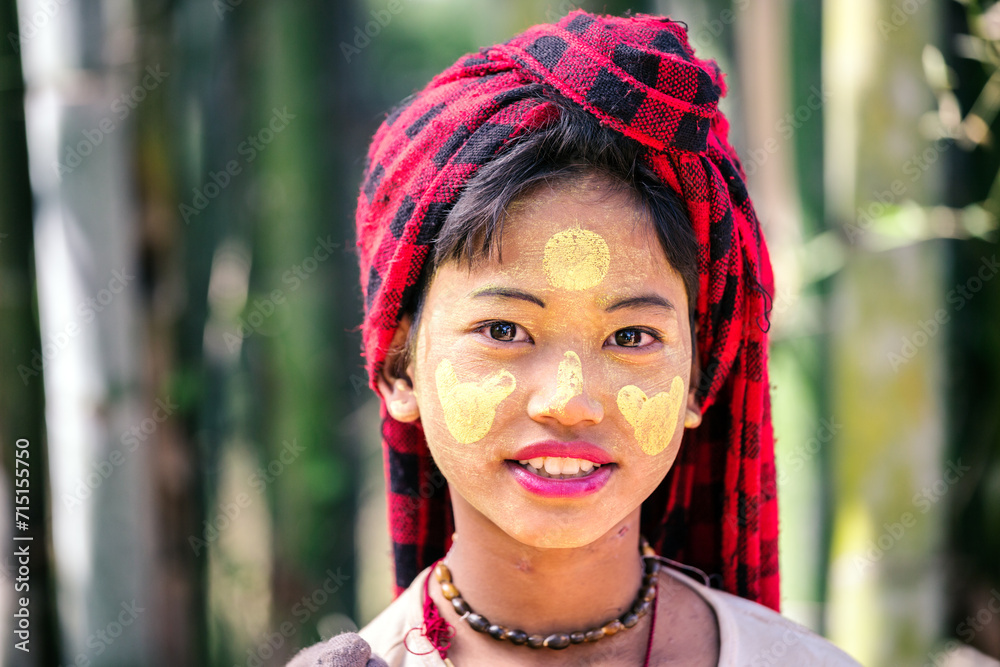 Portrait of young girl with typical headgear, Myanmar