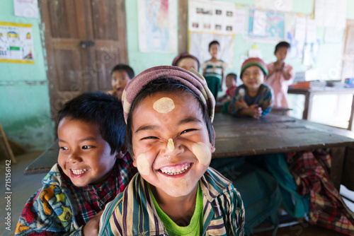 Children at primary school looking at camera and smiling, Kempetlet, Myanmar photo