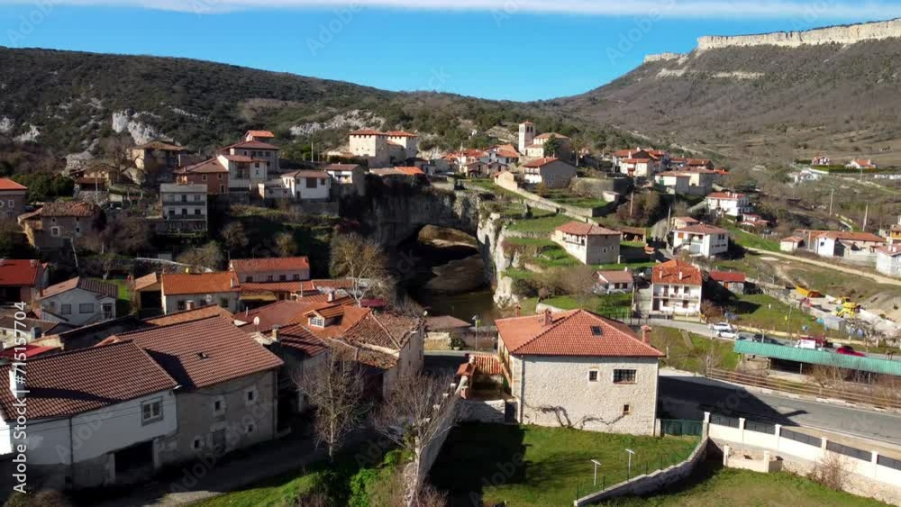 Aerial view of Puentedey, a picturesque village with a natural bridge over the river. Burgos, Spain. High quality 4k footage Aerial view of Puentedey, a picturesque village with a natural bridge over the river. Burgos, Spain. High quality 4k footage
