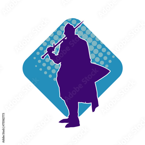 Silhouette of a male warrior wearing war armor suit in action pose using a sword weapon.