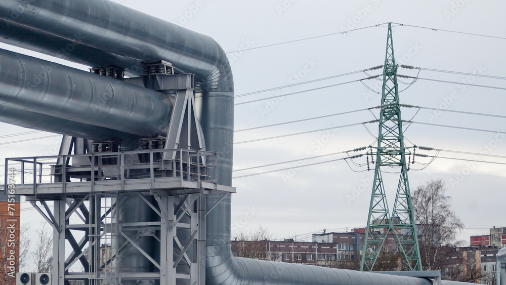 pipeline and power lines against the background of a gray sky pipeline and power lines against the background of a gray sky
