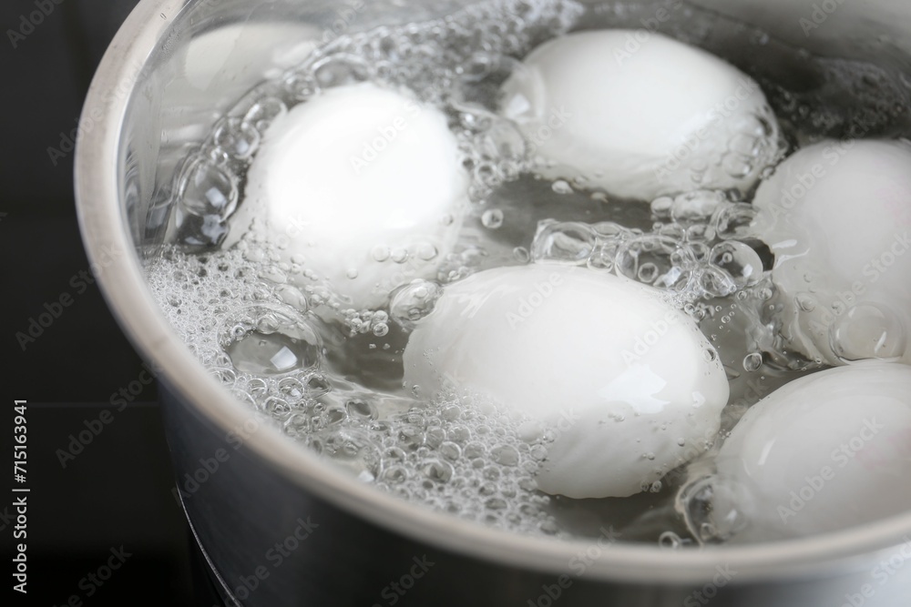 Chicken eggs boiling in saucepan, closeup view Chicken eggs boiling in saucepan, closeup view