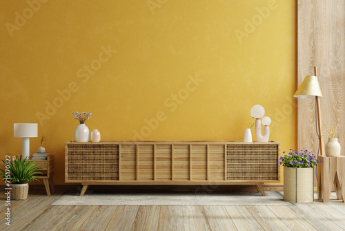 Modern interior of living room with cabinet for tv on yellow color wall background photo