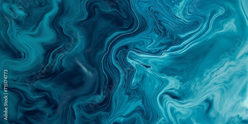 swirl of liquid paint in shades of blue and turquoise photo