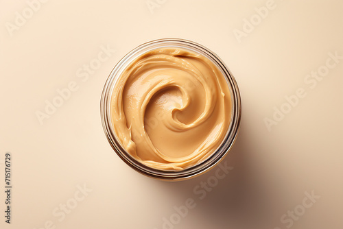 Generative AI Image of Top View of Peanut Butter in a Jar on Pink Background photo