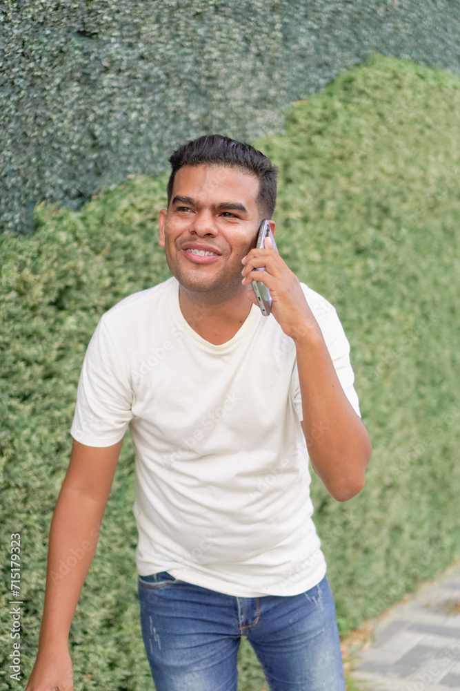 Latin Man with Braces Talking on Phone