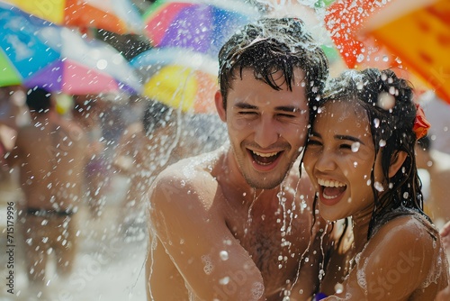 A joyful couple drenched in water, celebrating the vibrant and spirited Songkran Festival
