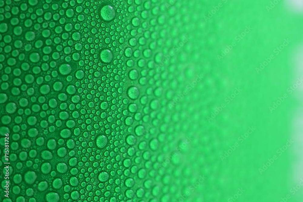 water drop on green beverage cans background, texture of cold aluminium drink package - obrazy, fototapety, plakaty 
