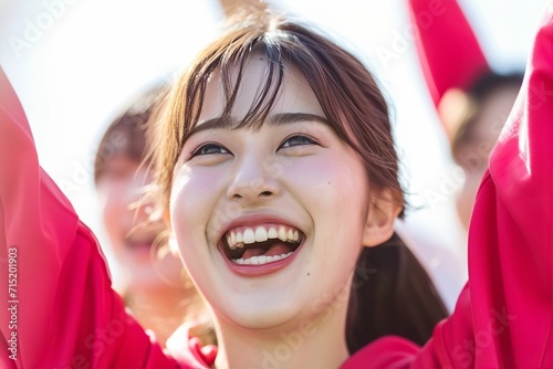 歓声をあげて応援する笑顔の日本人女性ポートレート（白背景・オリンピック・日本代表・ワールドカップ・世界大会・Jリーグ・野球・スポーツ） photo