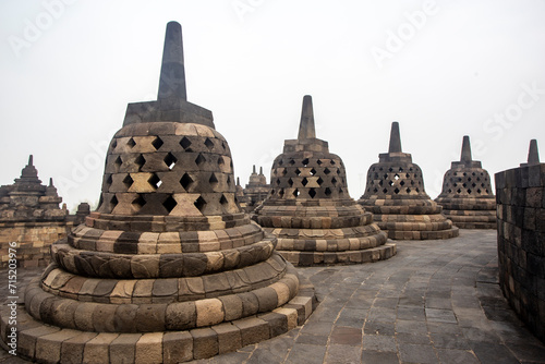 Stone Stupas At Borobudur Temple In Central Java, Indonesia. The Borobudur Temple Compounds Is One Of The Greatest Buddhist Monuments In The World.