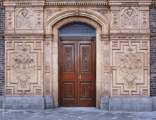Entrance to 19th century building with ornate exterior decorations