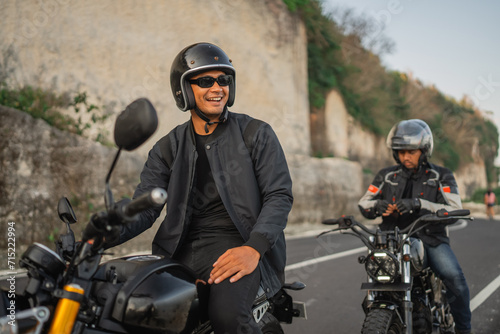 fun adventure of indonensian riders driving motorbike around countryside