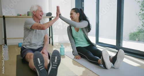 Physiotherapist, yoga stretching and old man high five for spine alignment success, healing or fitness achievement. Rehabilitation, clinic and physical therapist celebrate with happy senior client photo