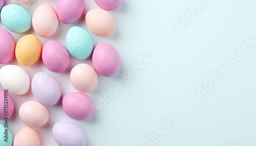 Top view of colorful Easter eggs on soft blue background with copy space for text. Multicolor painted eggs on light surface. Generative AI. © cabado