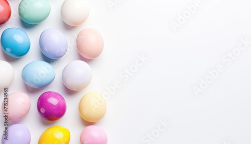 Top view of colorful Easter eggs on white background with copy space for text. Multicolor painted eggs on light surface. Generative AI.