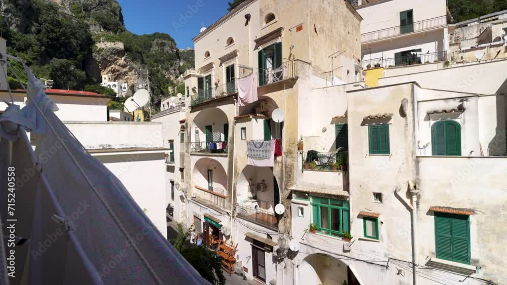 Beautiful Italian apartment building facades in the town of Atrani on the Amalfi Coast of Italy. Beautiful Italian apartment building facades in the town of Atrani on the Amalfi Coast of Italy.