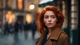 Portrait of a woman on a big city street. She is looking off to the side, as if lost. She had red hair and is wearing a heavy brown winter coat.